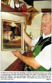 Wirt der Mühle mit Ölbild der alten Mühle